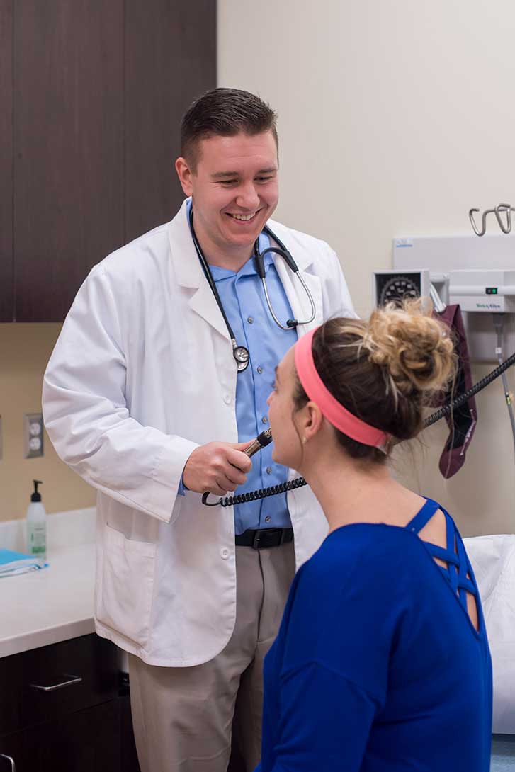PA examining patient at Ohio urgent care clinic